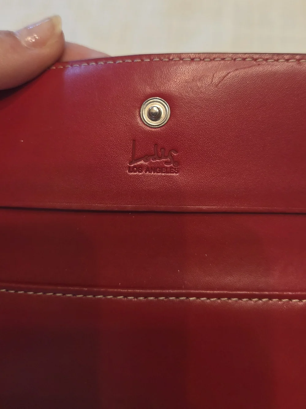 Lodis Black Leather Bi-Fold Wallet with Red Trim